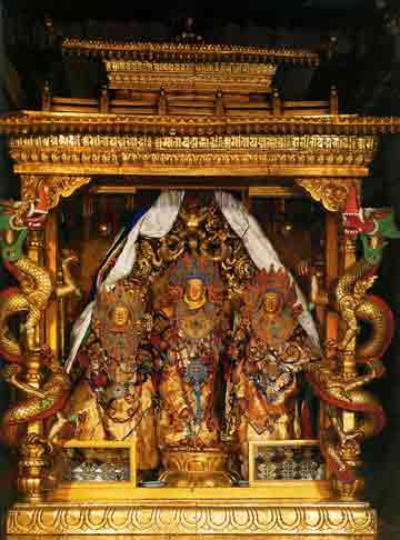 
In the middle is the revered sandalwood Lokeshvara statue. On the left is another sandalwood Lokeshvara statue, and on the right is a gilded copper Lokeshvata statue. - Splendor of Tibet: The Potala Palace book
